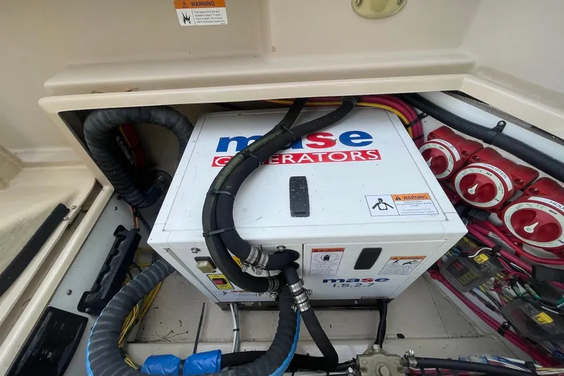 Slide: The Image of Engine compartment of a 2012 Ranger Tugs R-27 with Mase generator and wiring. - 21