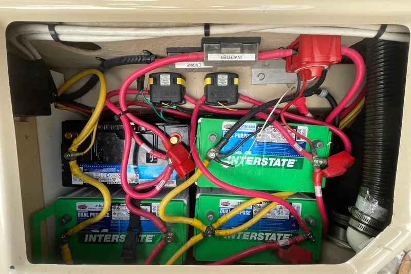 Slide: The Image of Battery compartment of 2012 Ranger Tugs R-27 with Interstate batteries and wiring. - 22