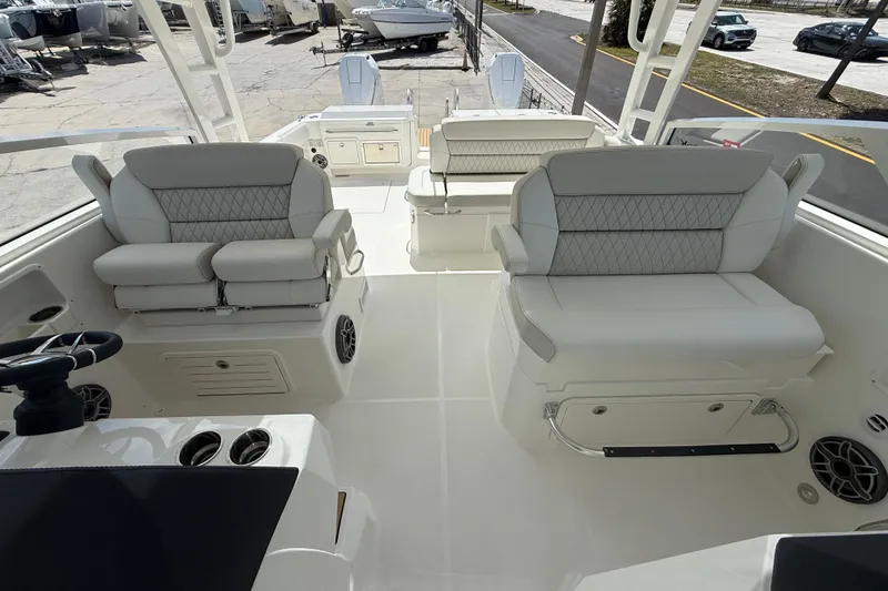 Slide: The Image of 2026 World Cat 400 DC-X Island boat interior with luxurious seating and modern design. - 17