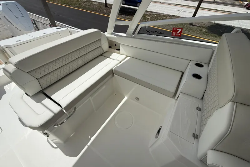 Slide: The Image of Luxurious seating area on the 2026 World Cat 400 DC-X Island boat. - 18