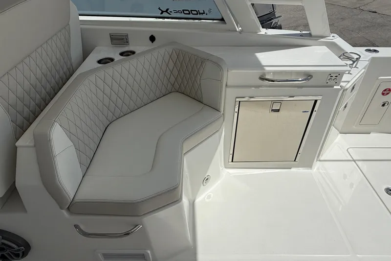 Slide: The Image of Luxurious seating area on 2026 World Cat 400 DC-X Island boat with quilted upholstery. - 19