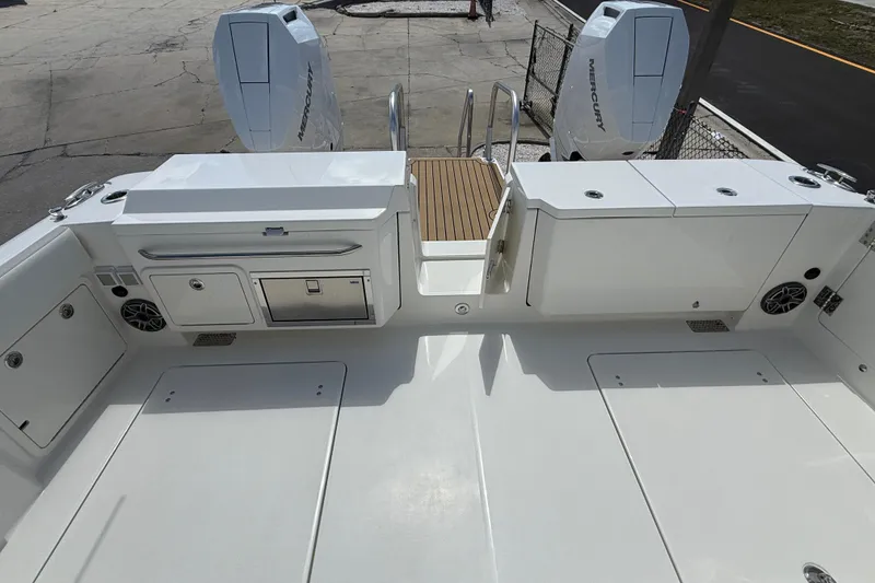 Slide: The Image of 2026 World Cat 400 DC-X Island boat deck with twin Mercury engines. - 20