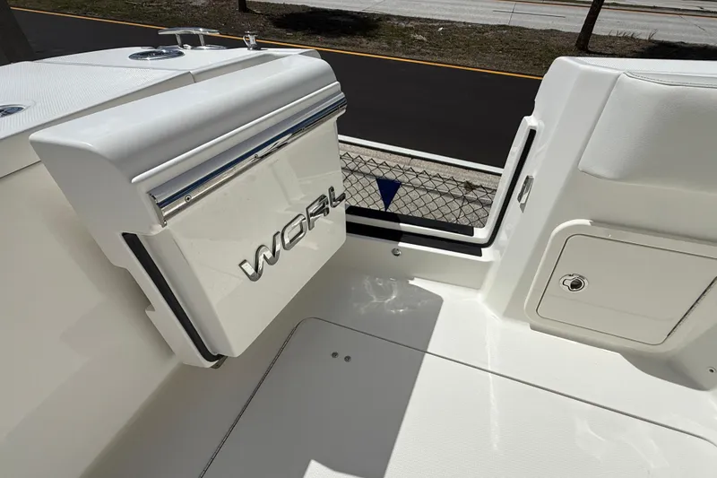 Slide: The Image of 2026 World Cat 400 DC-X Island boat interior detail with storage compartment. - 23