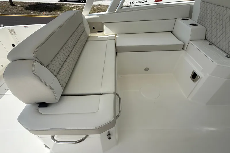 Slide: The Image of Luxurious seating on 2026 World Cat 400 DC-X Island boat, featuring elegant upholstery. - 25