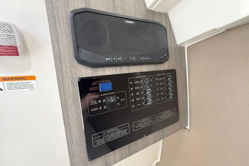 Slide: The Image of Control panel and speaker system on 2026 World Cat 400 DC-X Island boat. - 34