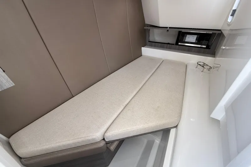 Slide: The Image of Interior cabin of 2026 World Cat 400 DC-X Island with beige seating. - 37