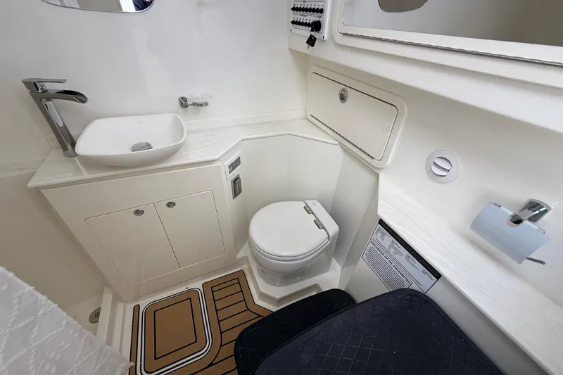 Slide: The Image of Luxurious bathroom in 2026 World Cat 400 DC-X Island boat, featuring modern fixtures and elegant design. - 41