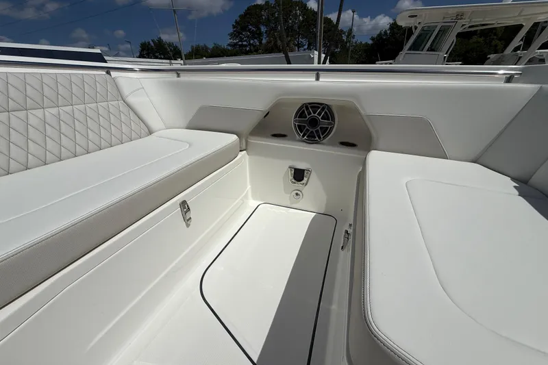 Slide: The Image of Luxurious seating area on 2026 World Cat 400 DC-X Island boat, featuring white upholstery. - 43