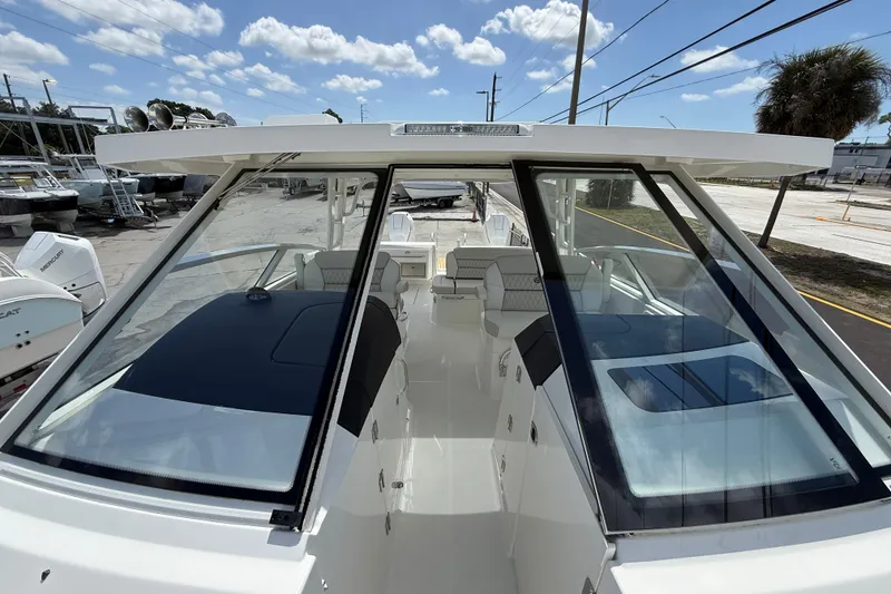Slide: The Image of 2026 World Cat 400 DC-X Island boat with sleek design and spacious interior. - 45