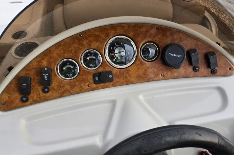Slide: The Image of Dashboard of 2012 Berkshire 230 CL LSR boat with gauges and controls. - 23