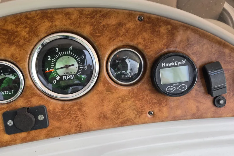 Slide: The Image of Dashboard of 2012 Berkshire 230 CL LSR with RPM and depth gauges. - 24
