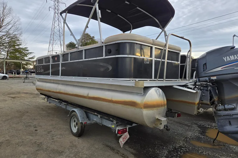 Slide: The Image of 2012 Berkshire 230 CL LSR pontoon boat on trailer, with Yamaha outboard motor. - 3