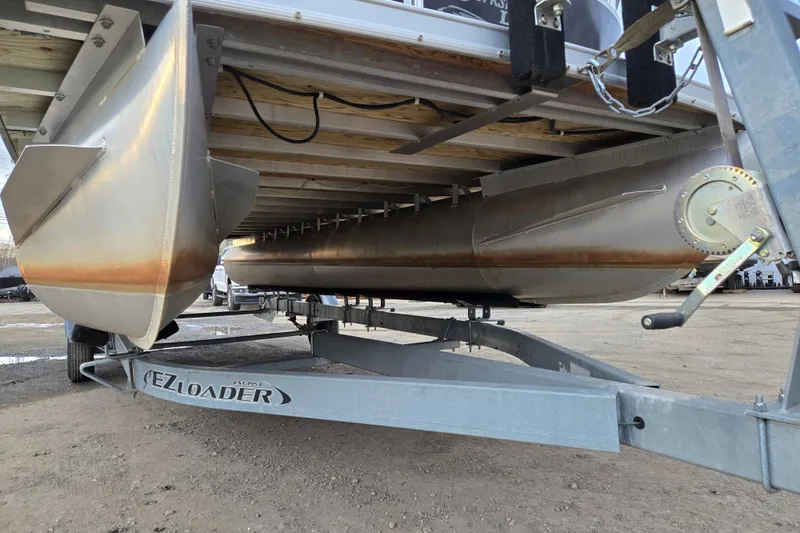 Slide: The Image of Underneath view of a 2012 Berkshire 230 CL LSR pontoon boat on EZ Loader trailer. - 5