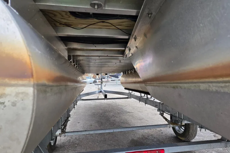 Slide: The Image of Underneath view of a 2012 Berkshire 230 CL LSR pontoon boat on a trailer. - 6