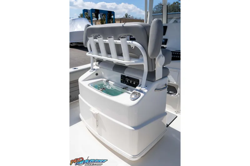 Slide: The Image of 2021 NauticStar 2602 Legacy boat console with rod holders and seating. - 22