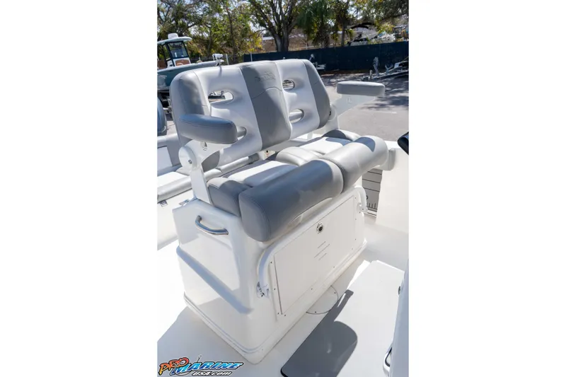 Slide: The Image of 2021 NauticStar 2602 Legacy boat seating with gray and white cushioned design. - 27