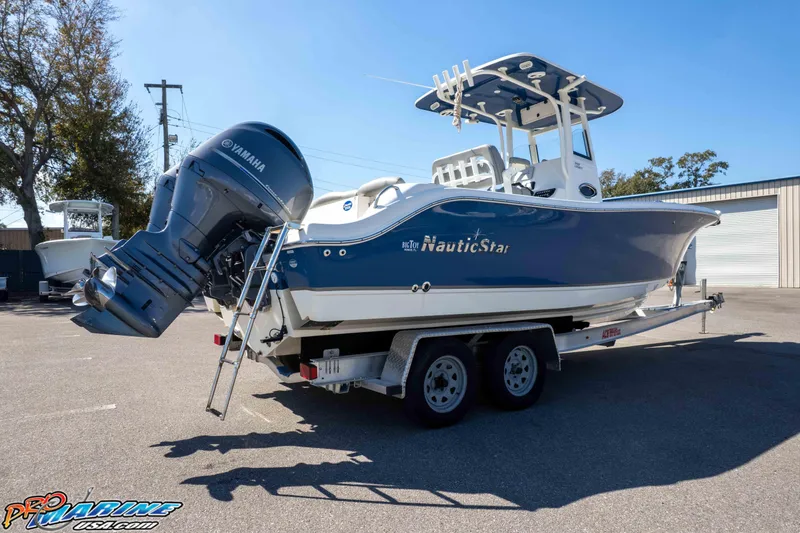 Slide: The Image of 2021 NauticStar 2602 Legacy boat on trailer with Yamaha outboard engine. - 41