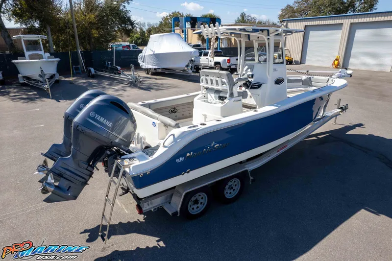Slide: The Image of 2021 NauticStar 2602 Legacy boat on trailer with Yamaha outboard engines. - 42