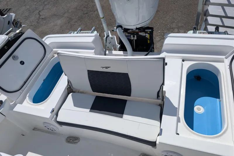 Slide: The Image of 2026 Tidewater 2300 Carolina Bay boat interior with seating and storage compartments. - 13