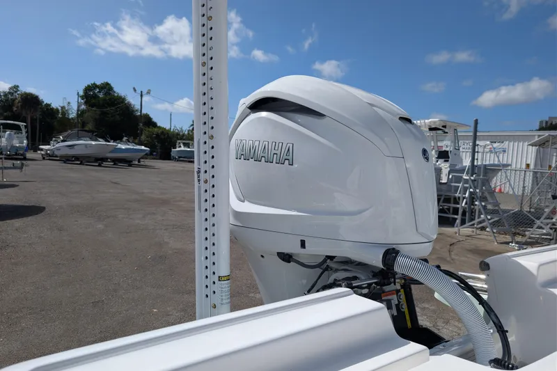 Slide: The Image of 2026 Tidewater 2300 Carolina Bay boat with Yamaha outboard motor in a marina setting. - 14