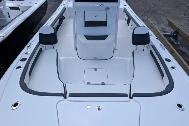 Slide: The Image of 2026 Tidewater 2300 Carolina Bay boat interior with seating and storage compartments. - 16