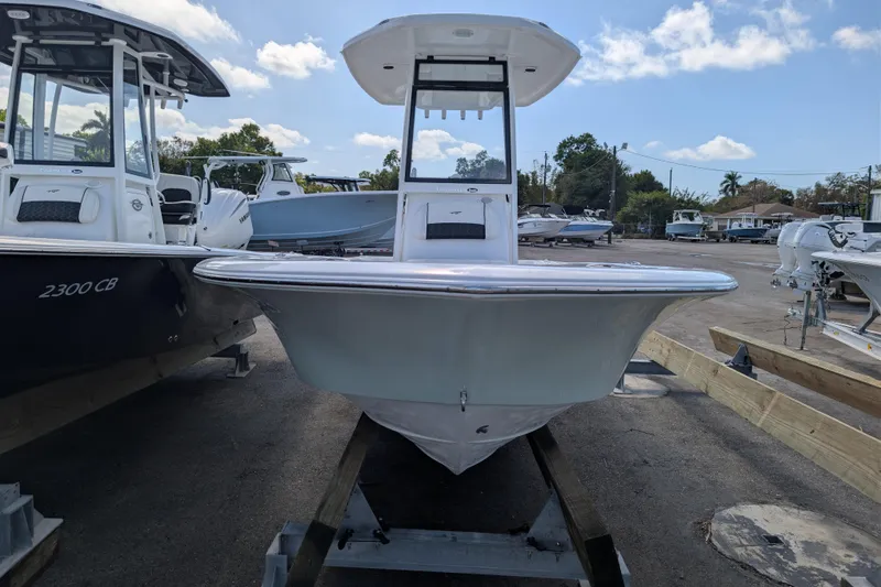 Slide: The Image of 2026 Tidewater 2300 Carolina Bay boat displayed outdoors under a clear sky. - 3