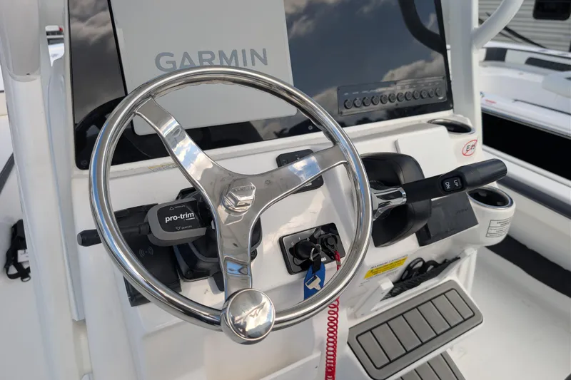 Slide: The Image of Steering console of 2026 Tidewater 2300 Carolina Bay boat with Garmin display. - 5