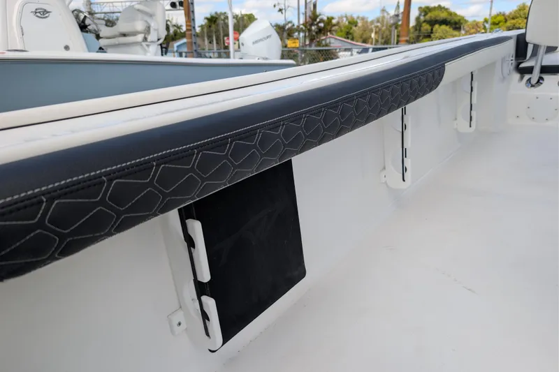 Slide: The Image of 2026 Tidewater 2300 Carolina Bay interior with sleek, modern design and cushioned side panel. - 6