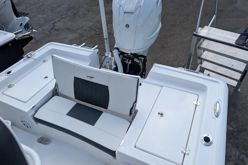 Slide: The Image of 2026 Tidewater 2300 Carolina Bay boat with seating and outboard motor. - 8