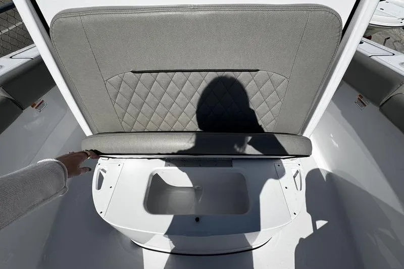 Slide: The Image of 2026 Sportsman Open 212 Center Console seat with storage compartment open. - 10