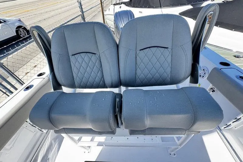 Slide: The Image of 2026 Sportsman Open 212 Center Console boat seats with diamond stitching. - 18