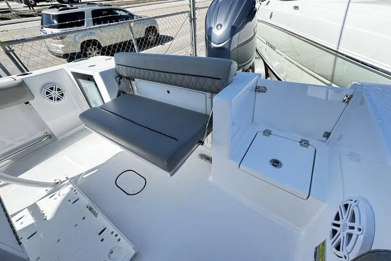 Slide: The Image of 2026 Sportsman Open 212 Center Console boat interior with seating and storage. - 22