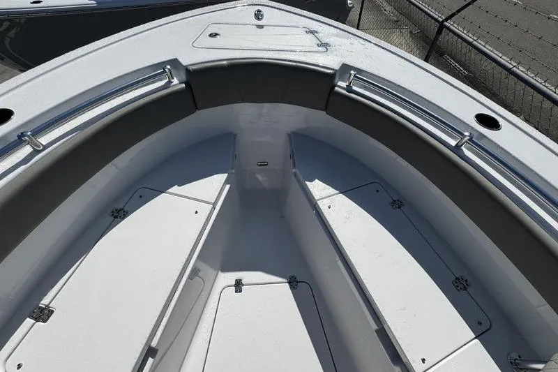 Slide: The Image of 2026 Sportsman Open 212 Center Console boat interior with seating and storage compartments. - 5