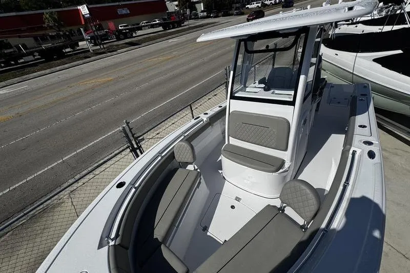Slide: The Image of 2026 Sportsman Open 212 Center Console boat with sleek design and spacious seating. - 8
