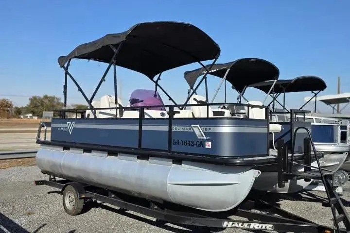 Slide: The Image of 2021 Misty Harbor Del Mar 18F pontoon boat on trailer, featuring dual canopies. - 10