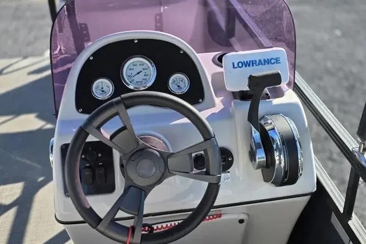 Slide: The Image of Steering console of 2021 Misty Harbor Del Mar 18F with Lowrance equipment. - 15