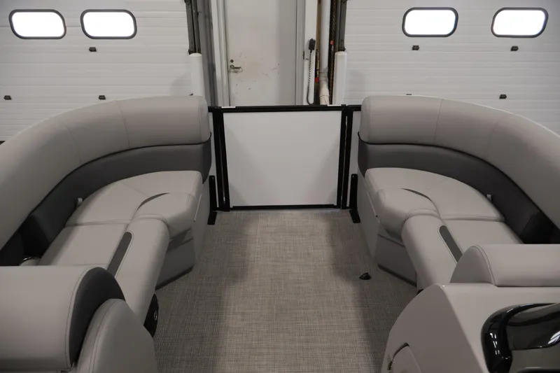 Slide: The Image of Interior of 2026 Bentley Pontoons Legacy 200 Navigator with plush seating and modern design. - 10