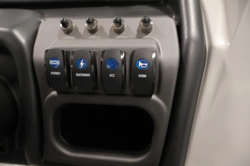 Slide: The Image of Control panel of 2026 Bentley Pontoons Legacy 200 Navigator with labeled switches. - 21
