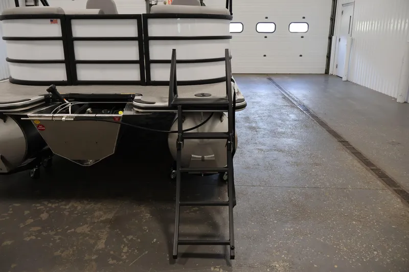 Slide: The Image of 2026 Bentley Pontoons Legacy 200 Navigator in a garage, rear view with ladder. - 32