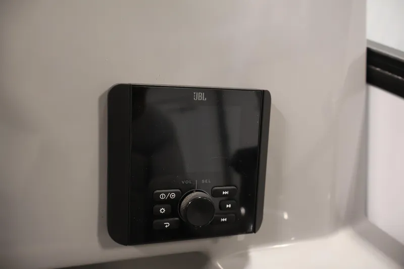Slide: The Image of JBL audio control panel on 2026 Bentley Pontoons Legacy 200 Navigator. - 22