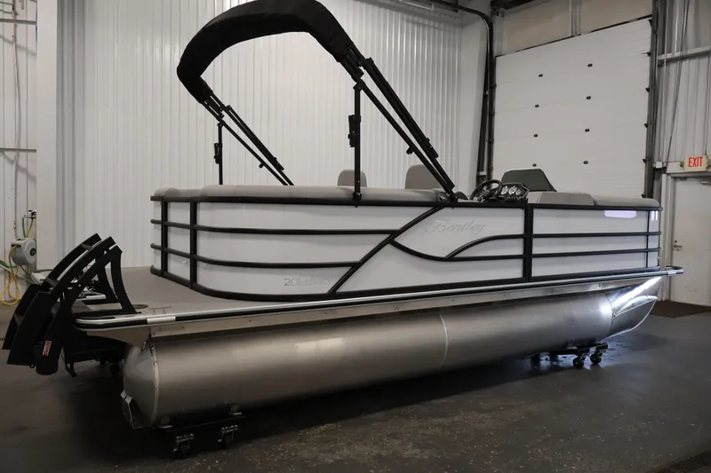 Slide: The Image of 2026 Bentley Pontoons Legacy 200 Navigator in a showroom, side view. - 3