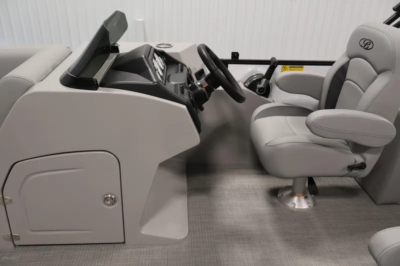 Slide: The Image of Interior of 2026 Bentley Pontoons Legacy 200 Navigator, featuring sleek helm and comfortable captain's chair. - 15