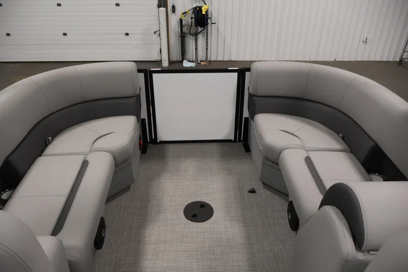 Slide: The Image of 2026 Bentley Pontoons Legacy 200 Navigator interior with gray seating and modern design. - 26