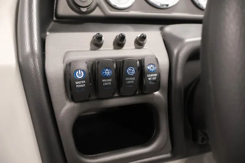 Slide: The Image of Control panel of 2026 Bentley Pontoons Legacy 200 Navigator with power and light switches. - 20