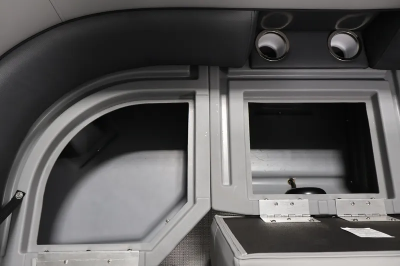 Slide: The Image of Interior compartments of 2026 Bentley Pontoons Legacy 200 Navigator, showcasing storage and cup holders. - 14