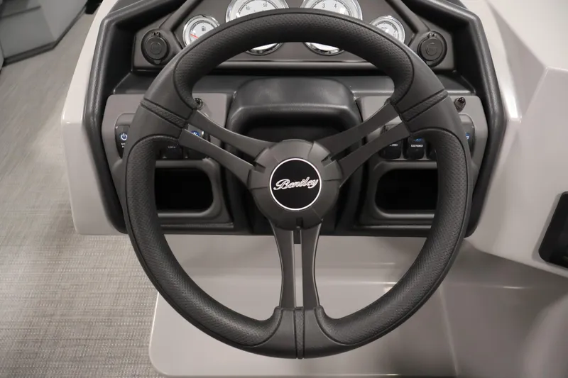 Slide: The Image of Steering wheel of 2026 Bentley Pontoons Legacy 200 Navigator, showcasing dashboard controls. - 18