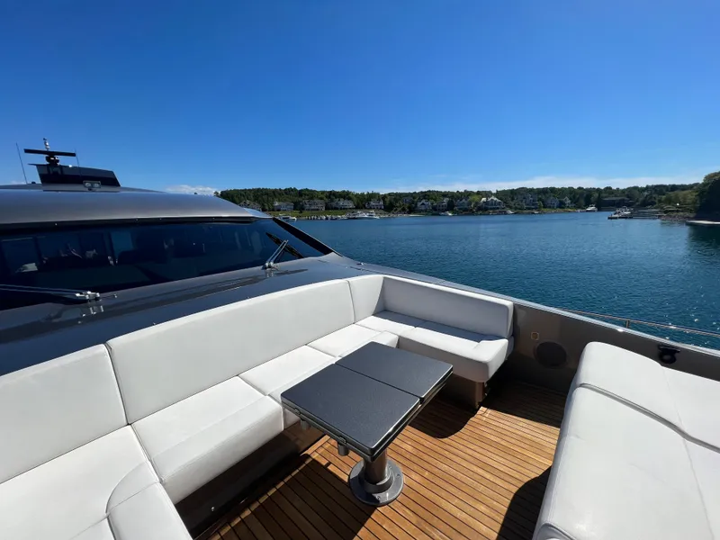 Slide: The Image of Luxurious 2017 Pershing 92 Motor Yacht with elegant seating and scenic water view. - 22