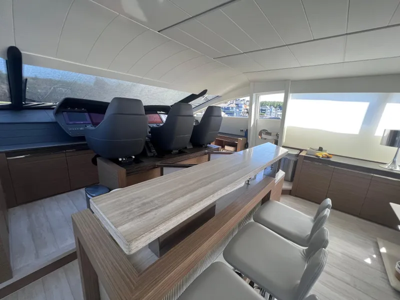 Slide: The Image of Interior of 2017 Pershing 92 Motor Yacht with modern helm and seating area. - 35