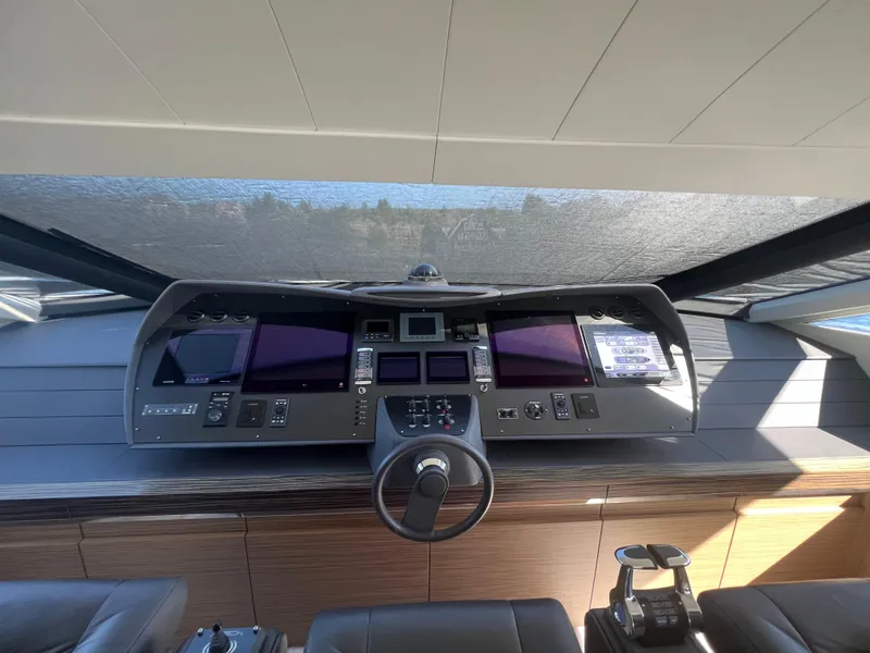 Slide: The Image of Helm of 2017 Pershing 92 Motor Yacht with advanced navigation controls and displays. - 37