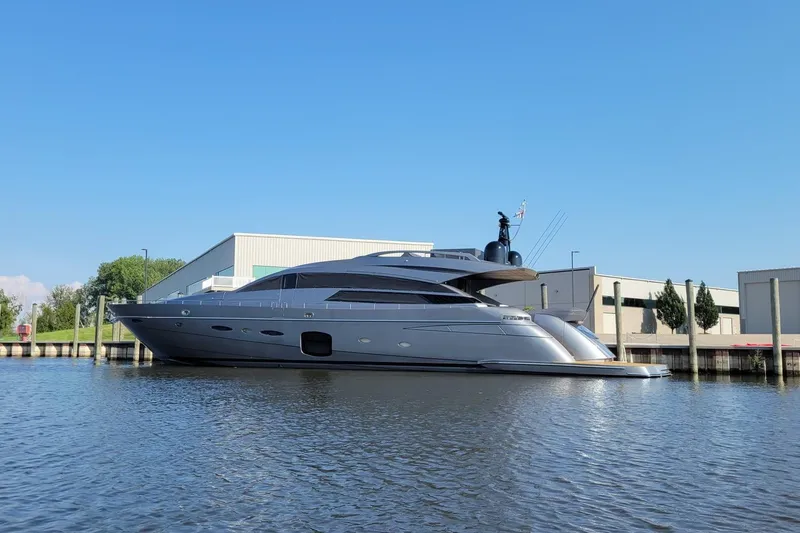 Slide: The Image of 2017 Pershing 92 Motor Yacht docked by industrial buildings on a sunny day. - 4